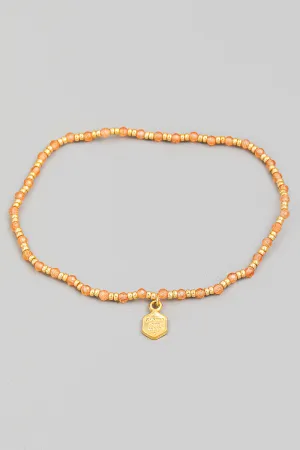 Delicate Beaded Bracelet In Brown With Charm In Pink/Gold Multi