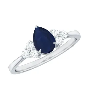 Pear Shaped Blue Sapphire Solitaire Ring with Diamond Trio